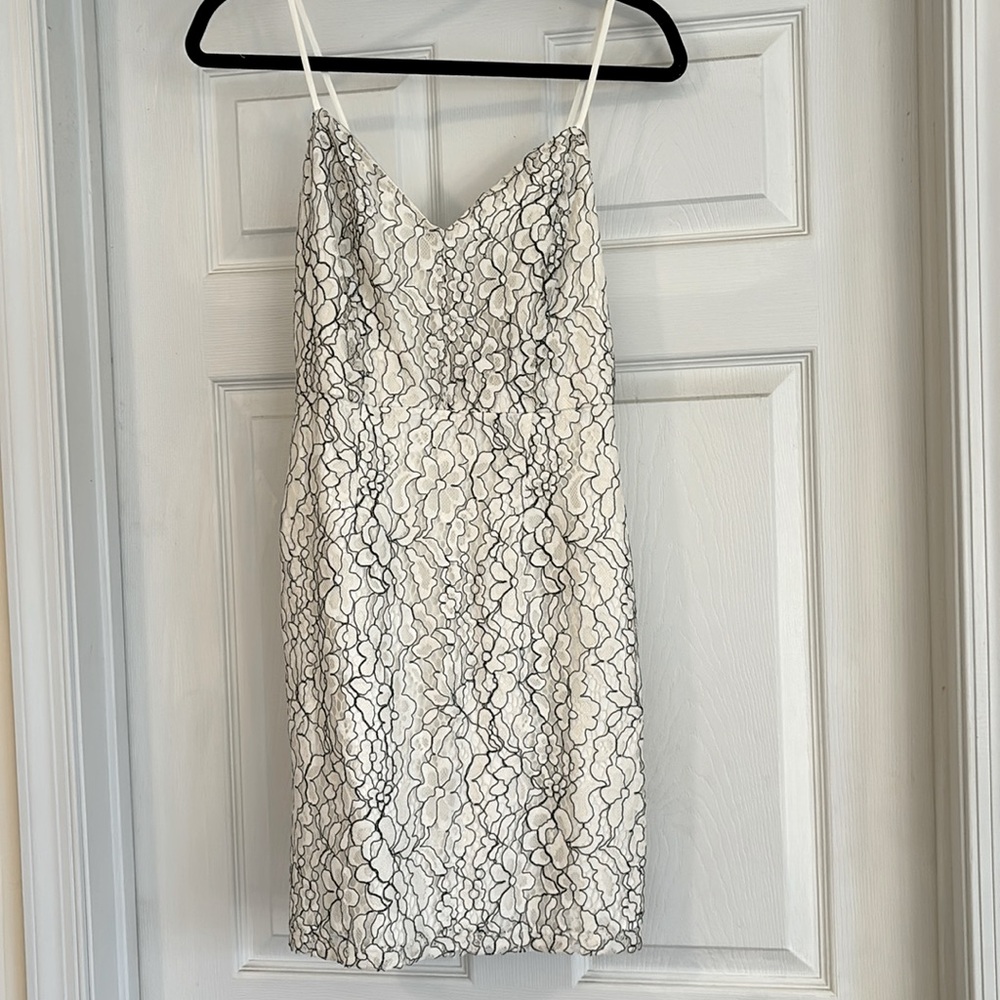 Size small dress NWT never worn lace overlay satin. Off white/black